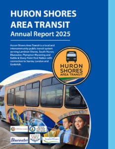 Cover of Huron Shores Area Transit Annual Report 2025 on a blue background, featuring a bus graphic inside a circular logo and sponsor logos at the bottom.